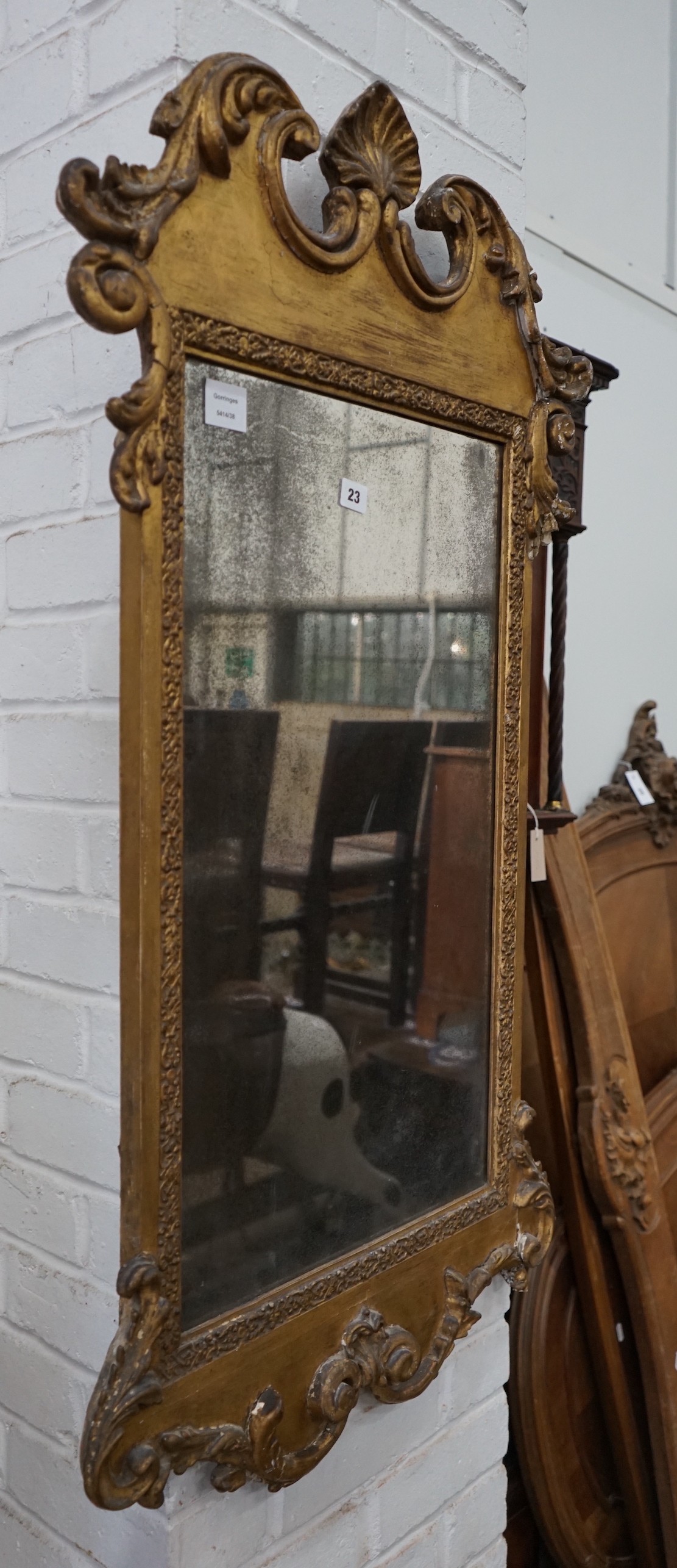 A 19th century carved giltwood wall mirror, width 61cm, height 110cm